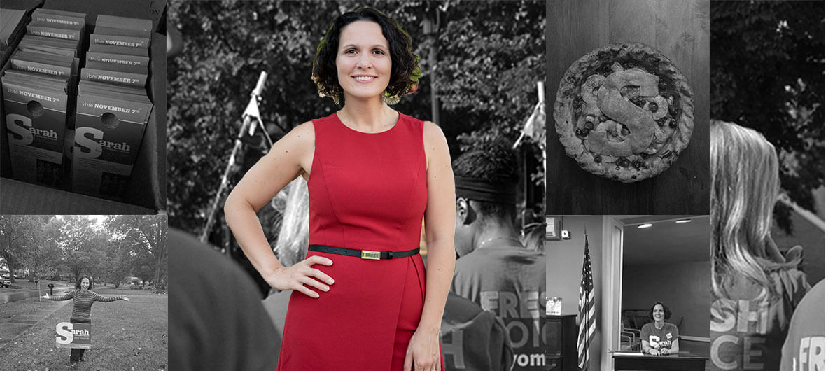 A photo of Sarah Stankorb, a white woman with brown hair wearing a red dress