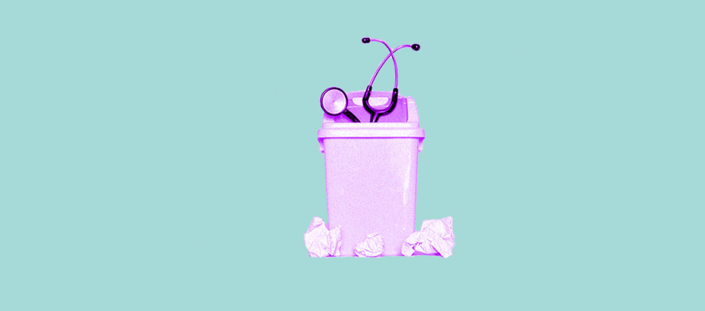 A pink stethoscope in a pink trash can.