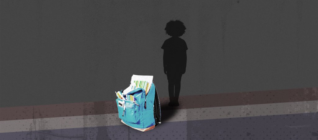 A silhouette of a kid in the background with a backpack stuffed with school supplies in the front